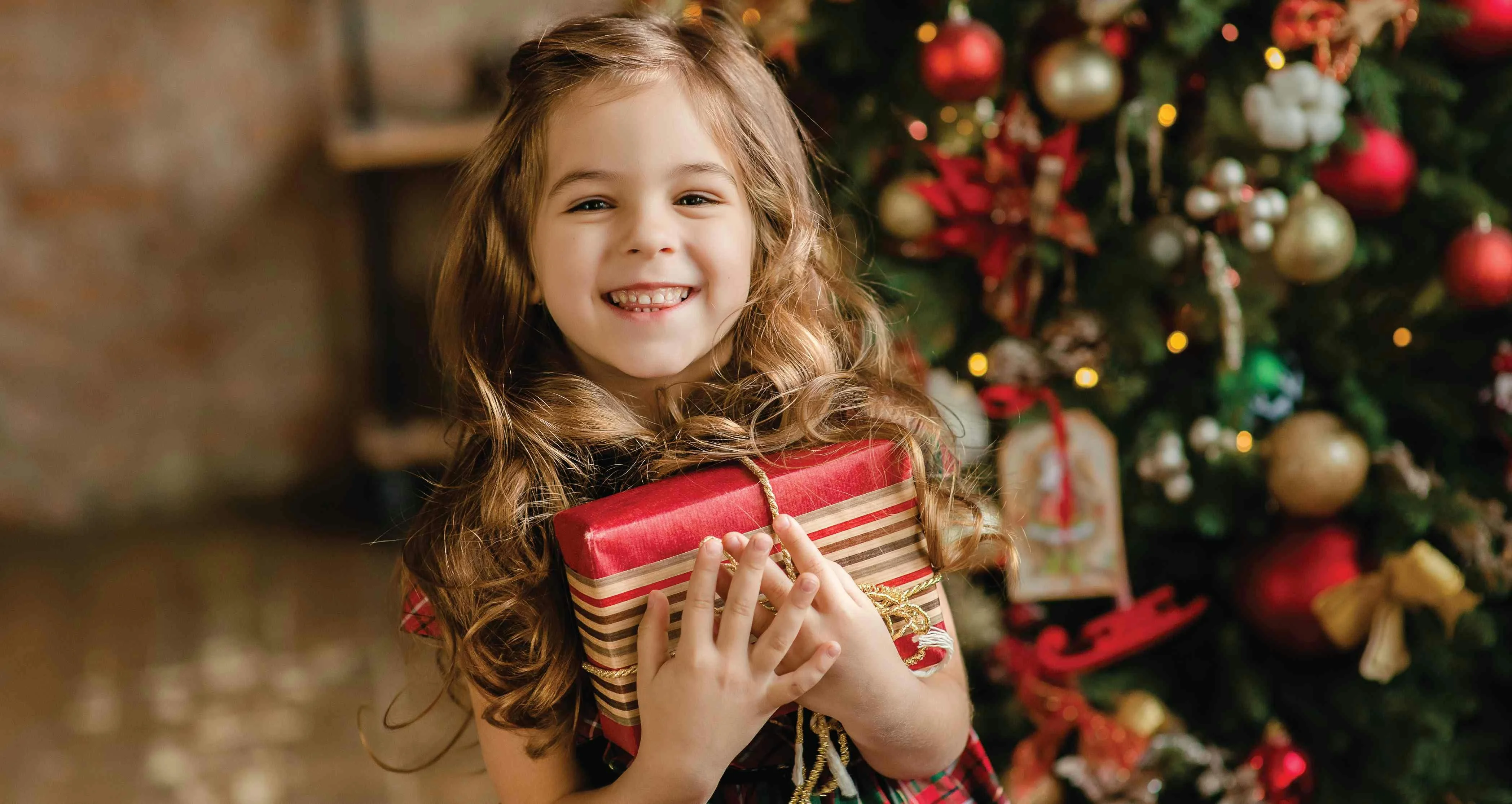 Happy girl with christmas presents